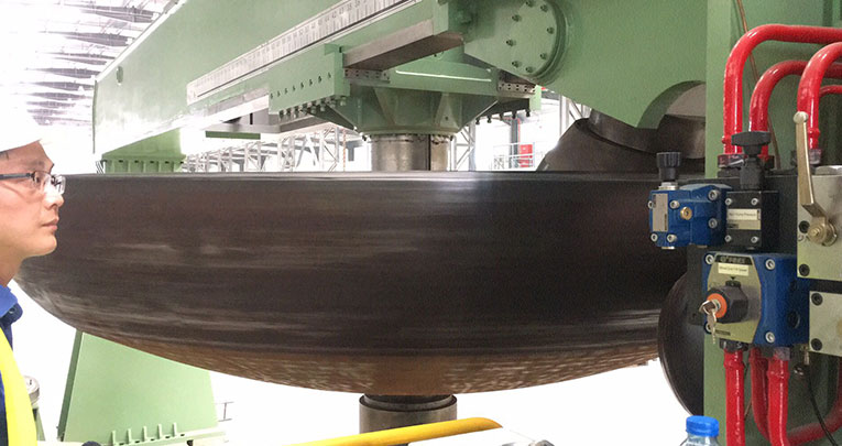 Dish end flanging machine